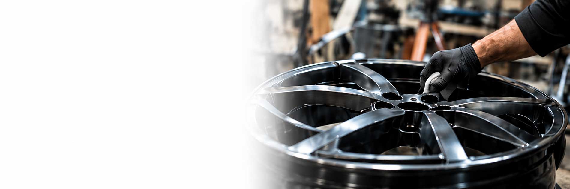 Gloved Hand Preparing an Alloy Wheel